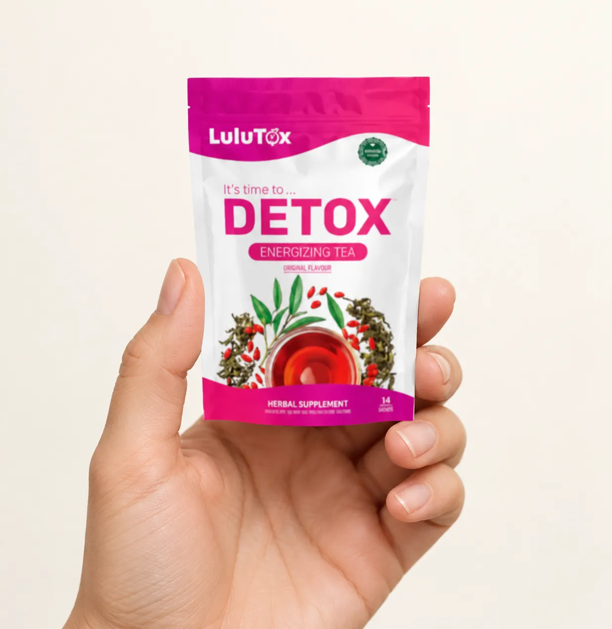 Lulutox Detox Tea HCTC — the package held in a hand